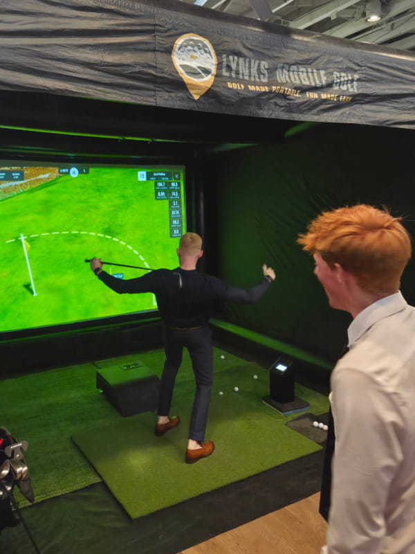 Golf simulator at a corporate team building event